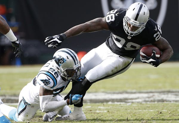 Latavius Murray, above, will take over from Adrian Peterson as the Vikings’ featured running back, but GM Rick Spielman said he is being careful abo