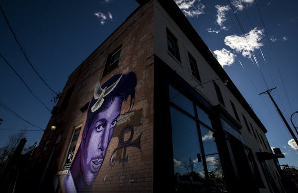 A mural of Prince by local artist Rock “Cyfi” Martinez on a building at 26th Street and Hennepin Avenue in Uptown Minneapolis.