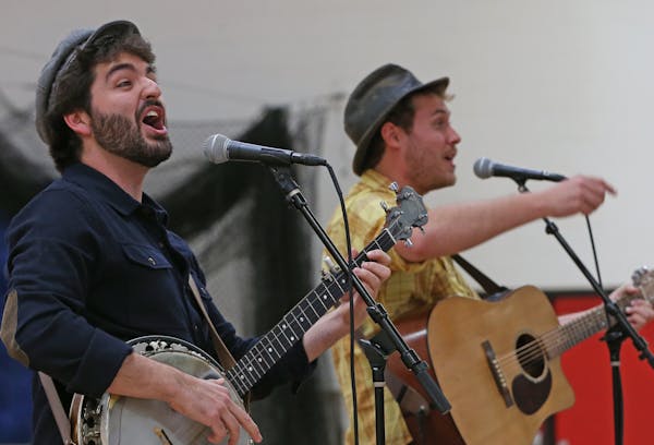 (left to right) The Okee Dokee Brothers, Justin Lansing and Joe Mailander performed at the St. Croix Lutheran School, on 4/11/14. Several hundred twin
