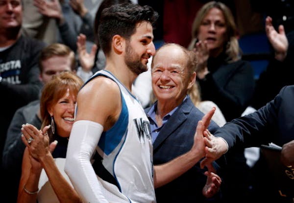 Timberwolves guard Ricky Rubio heard the cheers from fans -- including owner Glen Taylor, right -- after setting a franchise record with 19 assists ag