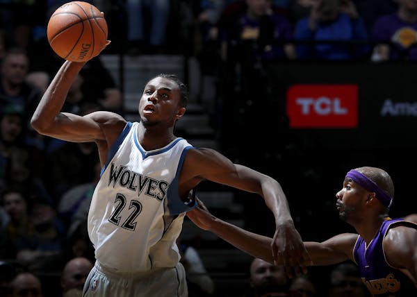 Former Wolves forward Corey Brewer, right, tried to keep up with Andrew Wiggins in the third quarter Thursday night.