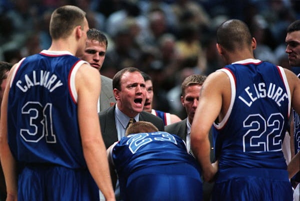 Dan Monson, with then-assistant Mark Few beside him, huddled with his players during 10th-seeded Gonzaga’s 73-72 victory over Florida in the NCAA re