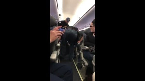 Passenger dragged off flight sparks uproar