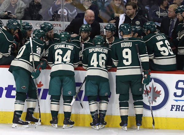 Wild coach Bruce Boudreau spoke to his team during a timeout in the first period against the Jets in Winnipeg on Sunday.