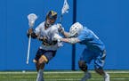 Prior Lake senior Carter Collins evaded a Bloomington Jefferson defender during the Lacrosse Showcase at Blake High School on Saturday. Collins had th