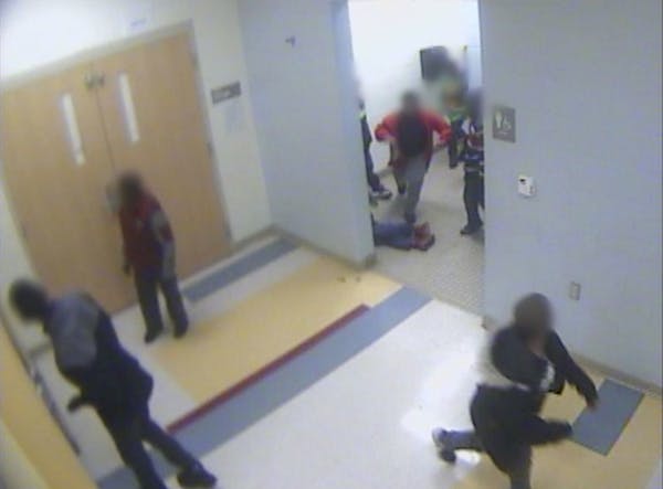In this still image from a Jan. 24, 2017, surveillance video provided by Cincinnati Public Schools, the legs and feet of 8-year-old Gabriel Taye can b