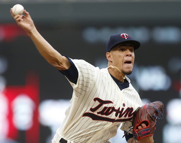 Minnesota Twins pitcher Jose Berrios throws against the Colorado Rockies during the third inning of the second game of a baseball doubleheader Thursda