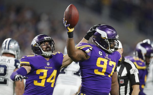 Minnesota Vikings strong safety Andrew Sendejo (34) celebrated defensive end Everson Griffen's (97) fumble recovery last season vs. Dallas.