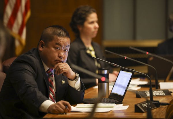 St. Paul councilmember Dai Thao listened to Finance Director Todd Hurley respond to a question he had about the Frank Baker settlement before the coun