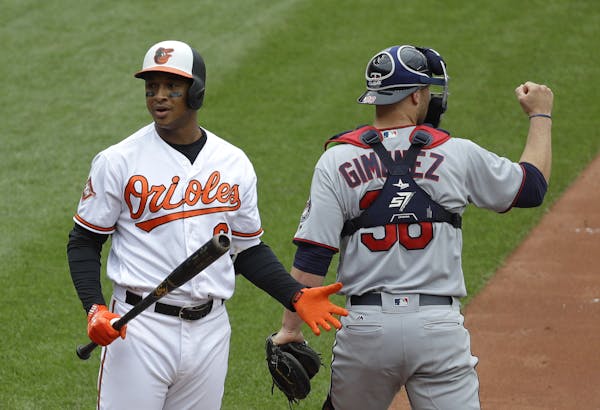 Jonathan Schoop of the Orioles reacted after striking out Wednesday to leave the bases loaded in the fourth inning. Twins catcher Chris Gimenez salute