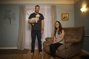 Anthony and Amy Ongaro with their dog, Rocky, in their south Minneapolis home. .