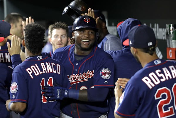 Miguel Sano flashed a big smile while celebrating his two-run homer with teammates in the ninth inning.