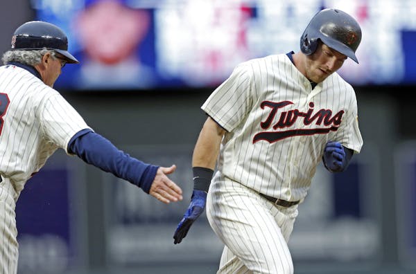 The Twins’ Robbie Grossman rounded third base on a two-run home run off Royals pitcher Ian Kennedy in the first inning of the second game of a baseb