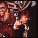 Harrison Ford, right, as Han Solo and Peter Mayhew as Chewbacca in an image from the 1977 release of "Star Wars."