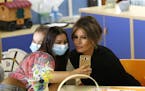 First Lady Melania Trump poses for a selfie with a girl during her visit to the pediatric hospital Bambin Gesu' at the Vatican, Wednesday, May 24, 201