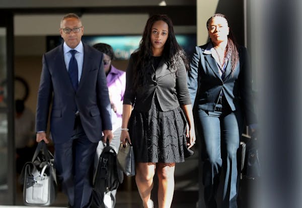 Diamond Reynolds, center, the girlfriend of Philando Castille, arrives in court Tuesday in the trial of officer Jeronimo Yanez in St. Paul.