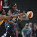 Lynx center Sylvia Fowles, right, and Sky forward Cheyenne Parker chased after a loose ball in the first quarter of Sunday’s WNBA opener at Xcel Ene