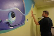 Artist Greg Preslicka volunteered to paint murals on bedroom walls of the Greater Minneapolis Crisis Nursery.