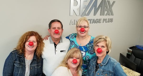 Left to right: Teri Wirt, Randy Walker, Sherry Lewandowski, Lisa Handley and Julie Gould at Re/Max Advantage Plus supported Red Nose Day.