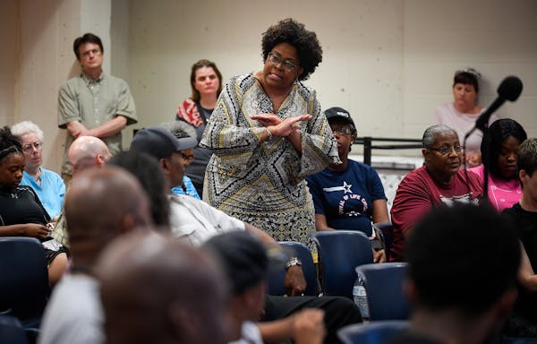 Coming together: A woman at the Hallie Q. Brown Community Center urged community members to push for change.