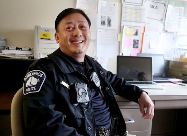 Phillip Xiong, a Minneapolis police school resource officer (SRO) at Transition Plus High School, talked about his days as a singer as a young man whi