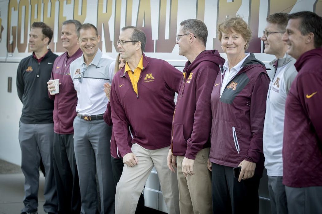 University of Minnesota coaches lined up for a photo before they loaded a bus as they launched their summer caravan with a kickoff party outside TCF Bank Stadium, Monday, May 22, 2017 in Minneapolis, MN.