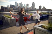 After drinks on the rooftop with friends who live in the A-Mill Lofts, Maryrose Dolezal and Roya Moltaji, right, danced with each other when "their" s