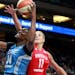 The Minnesota Lynx Sylvia Fowles (34) scores over the Washington Mystic’s Elena Belle Donne (11) during the first period Friday, June 22, 2017, at t
