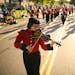 Zamara Tomko played an electric violin in the Richfield High School marching band as they participated in the RoseFest Rose Parade Monday evening.