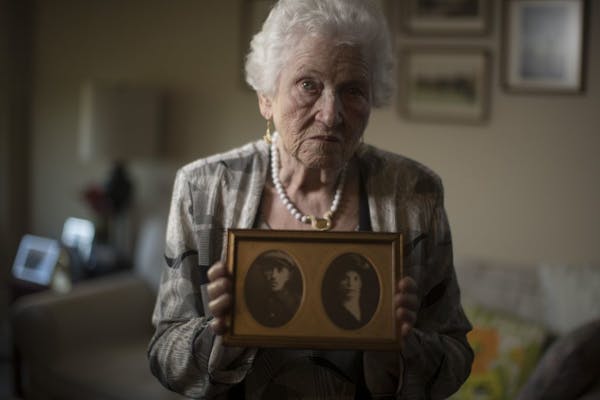 Holocaust survivor Judy Meisel of St. Louis Park held a photo of her parents Osser Beker (father) and Mika Beker (mother) that was taken around 1938.