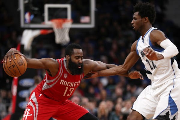 Minnesota Timberwolves forward Andrew Wiggins (22) tries to defend against Houston Rockets guard James Harden (13) in overtime. ] ANTHONY SOUFFLE � 