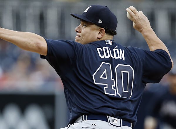 Atlanta Braves starting pitcher Bartolo Colon throws to the plate during the first inning of a baseball game against the San Diego Padres in San Diego