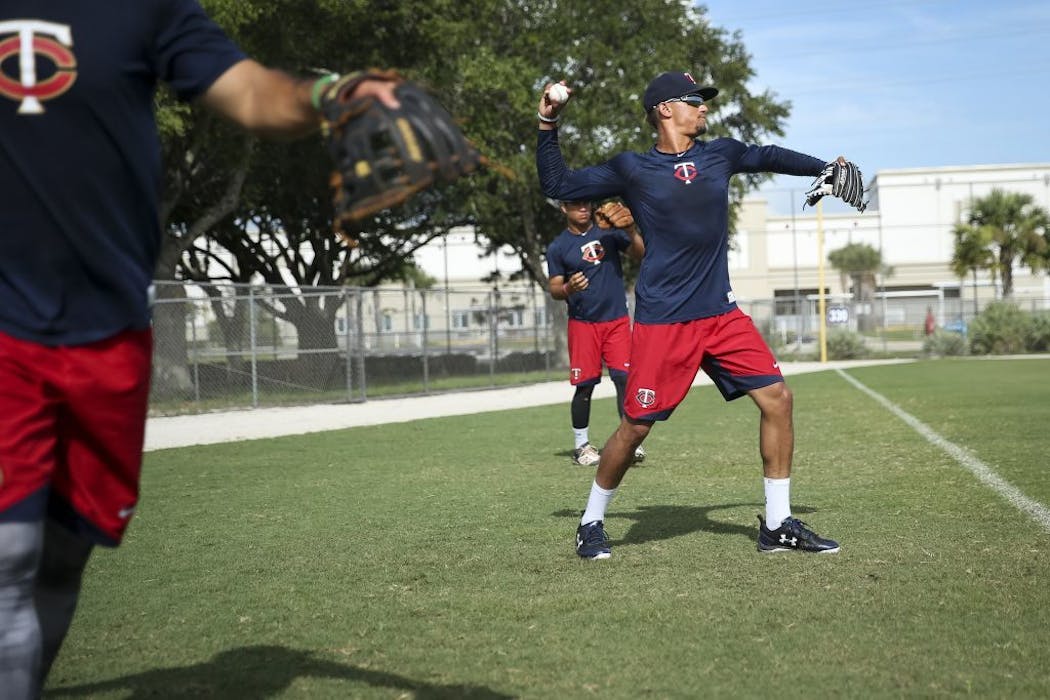 Lewis warms up with his GCL Twins teammates in Fort Myers.