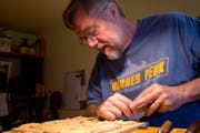 North House Folk School instructor Jock Holmen carved a Norwegian-style acanthus in the classroom at his home in Burnsville.