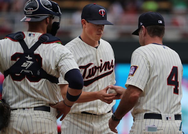 Trevor Hildenberger, being pulled in the seventh inning, was one of six Twins relievers who combined to give up seven runs and 11 hits to the Tigers o