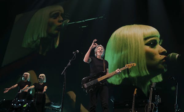 Roger Waters during “Time,” the third song in his set Wednesday night at Xcel Energy Center in St. Paul. With him were Holly Laessig, left, and Je