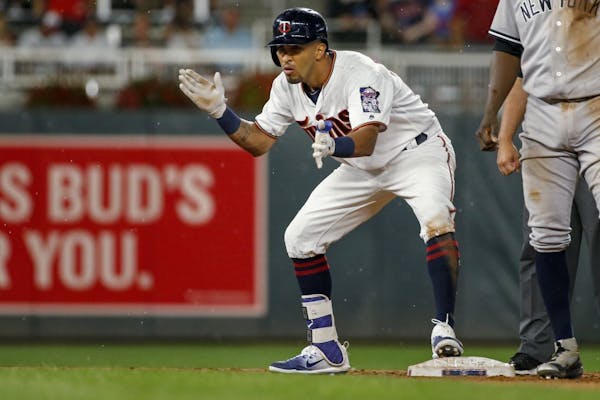 Minnesota Twins' Eddie Rosario celebrates his RBI double against the New York Yankees during the eighth inning of a baseball game Monday, July 17, 201