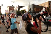 Protesters blocked traffic in downtown Minneapolis as they marched from Loring Park to City Hall on Friday night.
