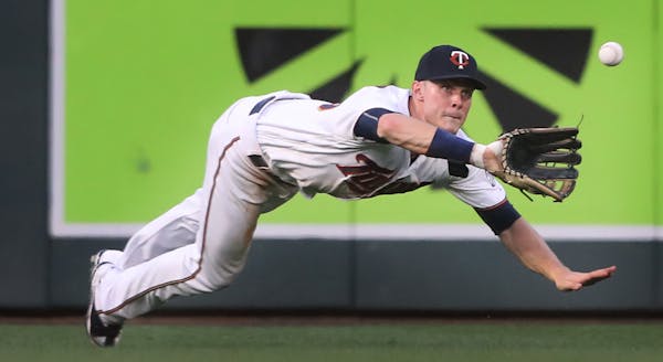 Minnesota Twins right fielder Max Kepler (26) dove to catch a fly ball hit by New York Yankees designated hitter Matt Holliday (17) in the forth innin