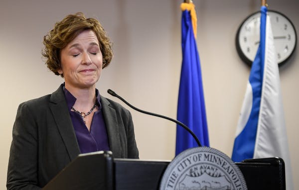 Minneapolis Mayor Betsy Hodges struggles to explain her decision at a City Hall news conference disrupted by protesters on Friday.