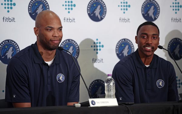 New Minnesota Timberwolves team members Taj Gibson, left, and Jeff Teague, right, sit together in Minneapolis, Monday, July 10, 2017. (Richard Tsong-T