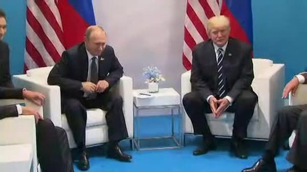 Trump, Putin hold first face-to-face meeting