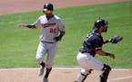 The Twins' Eddie Rosario scored on Jason Castro's double in the sixth inning Indians catcher Yan Gomes waited for a relay throw Sunday in Cleveland.