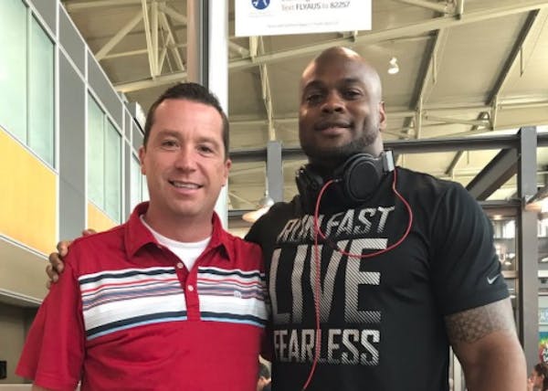 Chicago Bears linebacker Jerrell Freeman and the man he saved via Heimlich maneuver at the Austin airport.