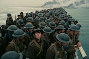 Cornered British troops on the beach at Dunkirk, France, await evacuation across the English Channel in “Dunkirk.”