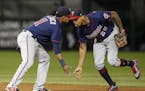 Minnesota Twins' Jorge Polanco (11) celebrates a win agains the Chicago White Sox with Byron Buxton (25) after game two of a baseball doubleheader, Mo