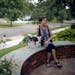 Bobbi Deeney and her dog, Oliver, on the patio in front of her house in the Minikahda Vista neighborhood of St. Louis Park.