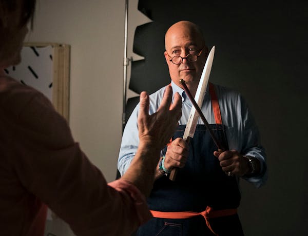 Photographer Steve Henke helped arrange a custom made Japanese knife in Andrew Zimmern's hands for a photoshoot for Midwest Living at his studio in Go