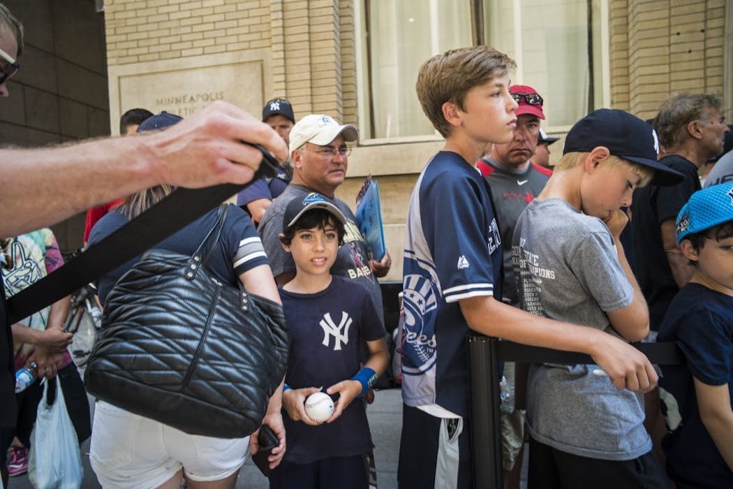 Yankees autograph seekers waited patiently in front of the Grand Hotel in Minneapolis.