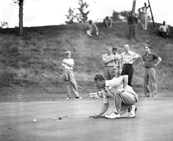 1953 Minnesota State Open champion Loren Krugel lines up a putt at Woodhill.